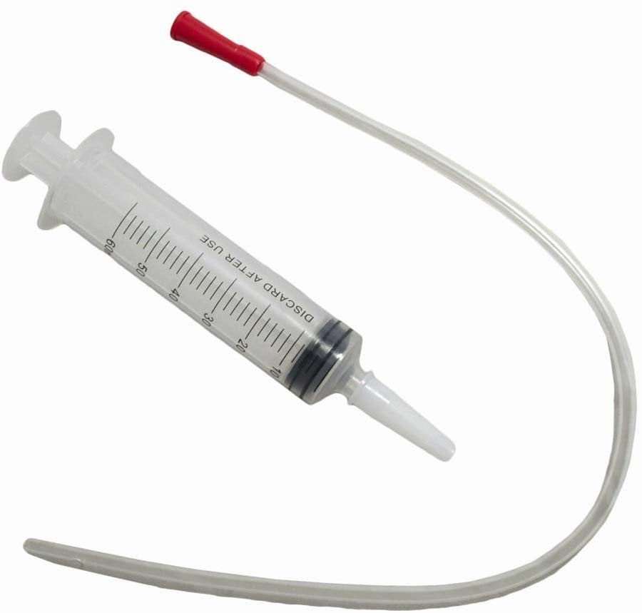 Catheter tip syringe and lamb stomach tube.