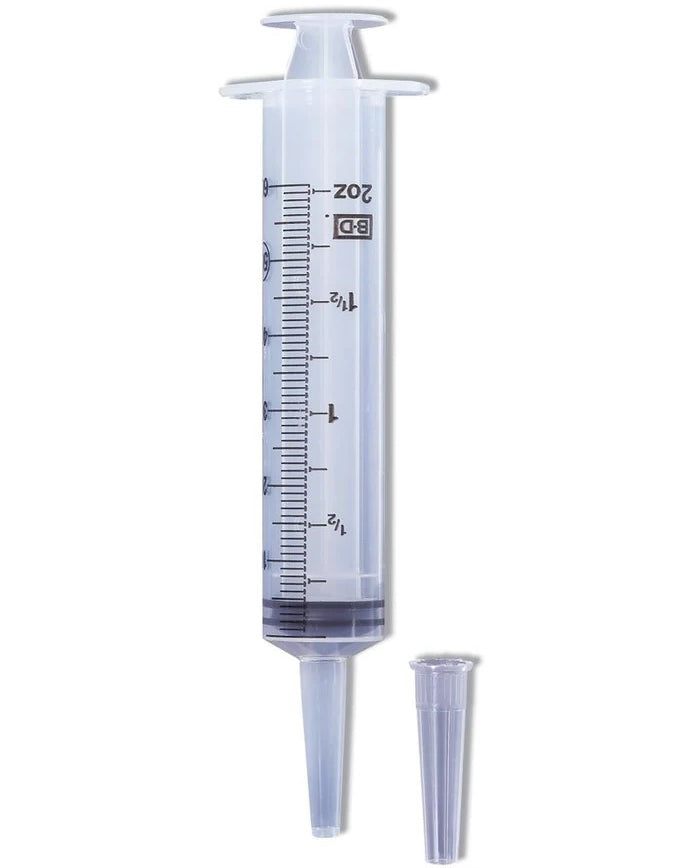 Catheter tip syringe with cap for administering oral medications to sheep.