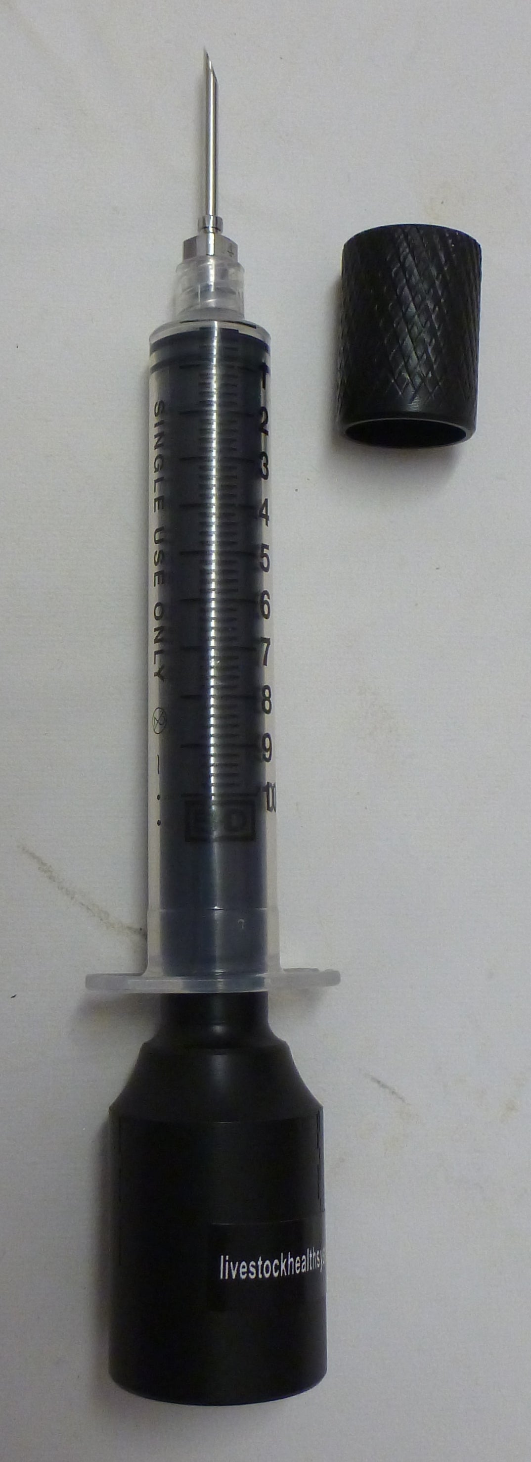 Syringe adapter with needle support cap removed